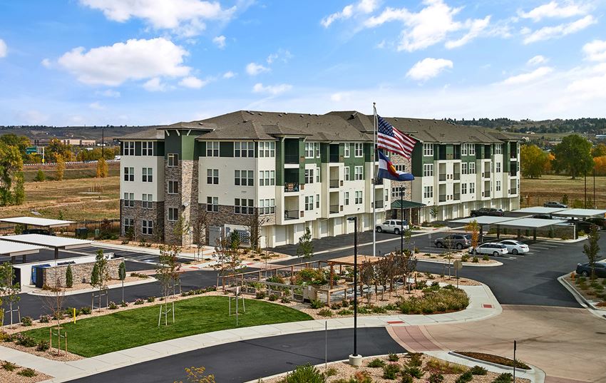 Enclave at Cherry Creek Apartments - Building exterior with ample parking - Photo Gallery 1
