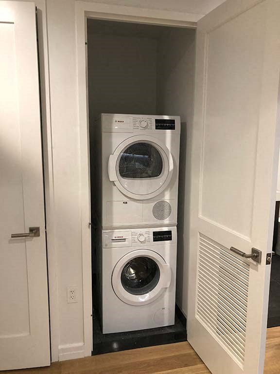 a washing machine and dryer in a small closet