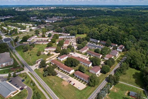 an aerial view of a city with houses and trees