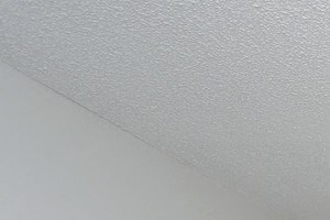 a living room with a couch and a ceiling fan