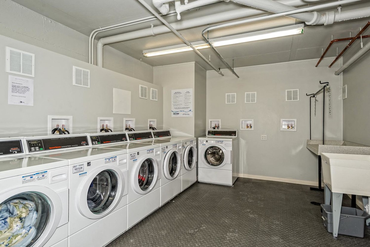 a washer and dryer in a laundry room with washing machines