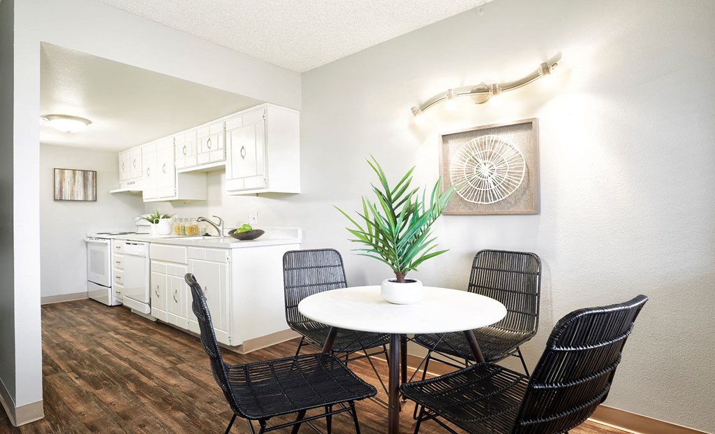 a dining room with a table and chairs