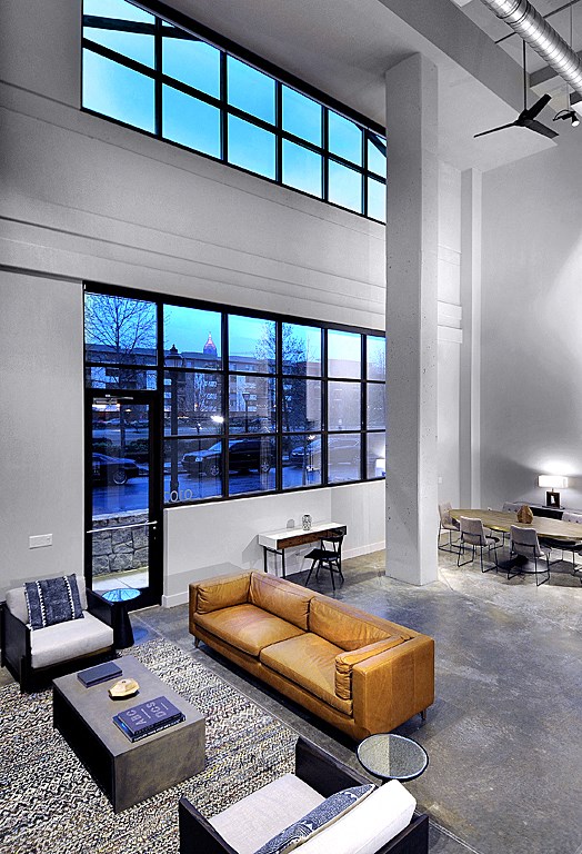 a living room with a couch and a large window