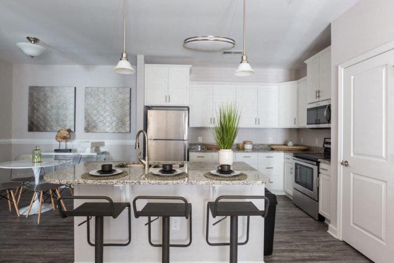 a kitchen with a table and chairs in it