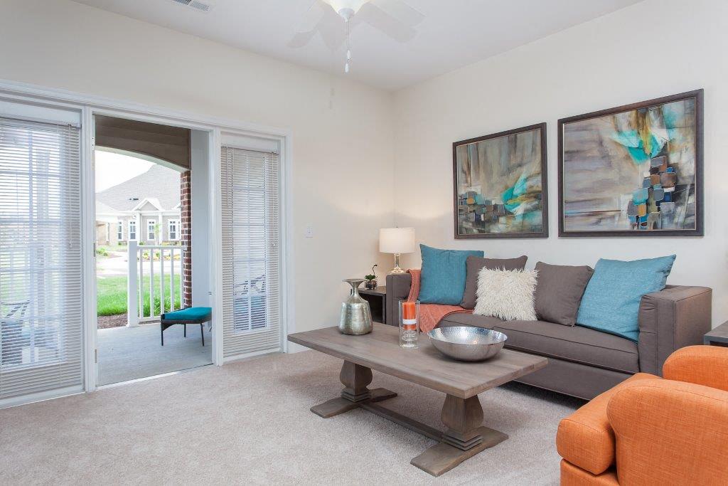 a living room with a couch and a table