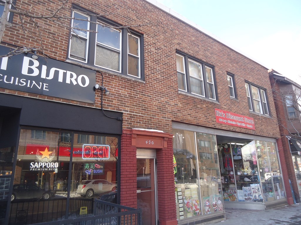 a brick building with a sign on the side of it