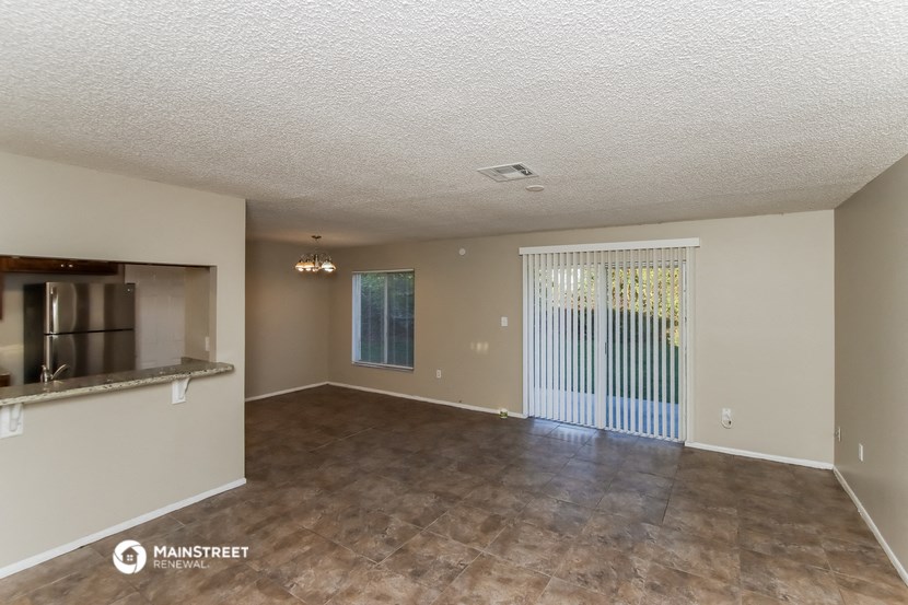 the spacious living room and kitchen of this manufactured home