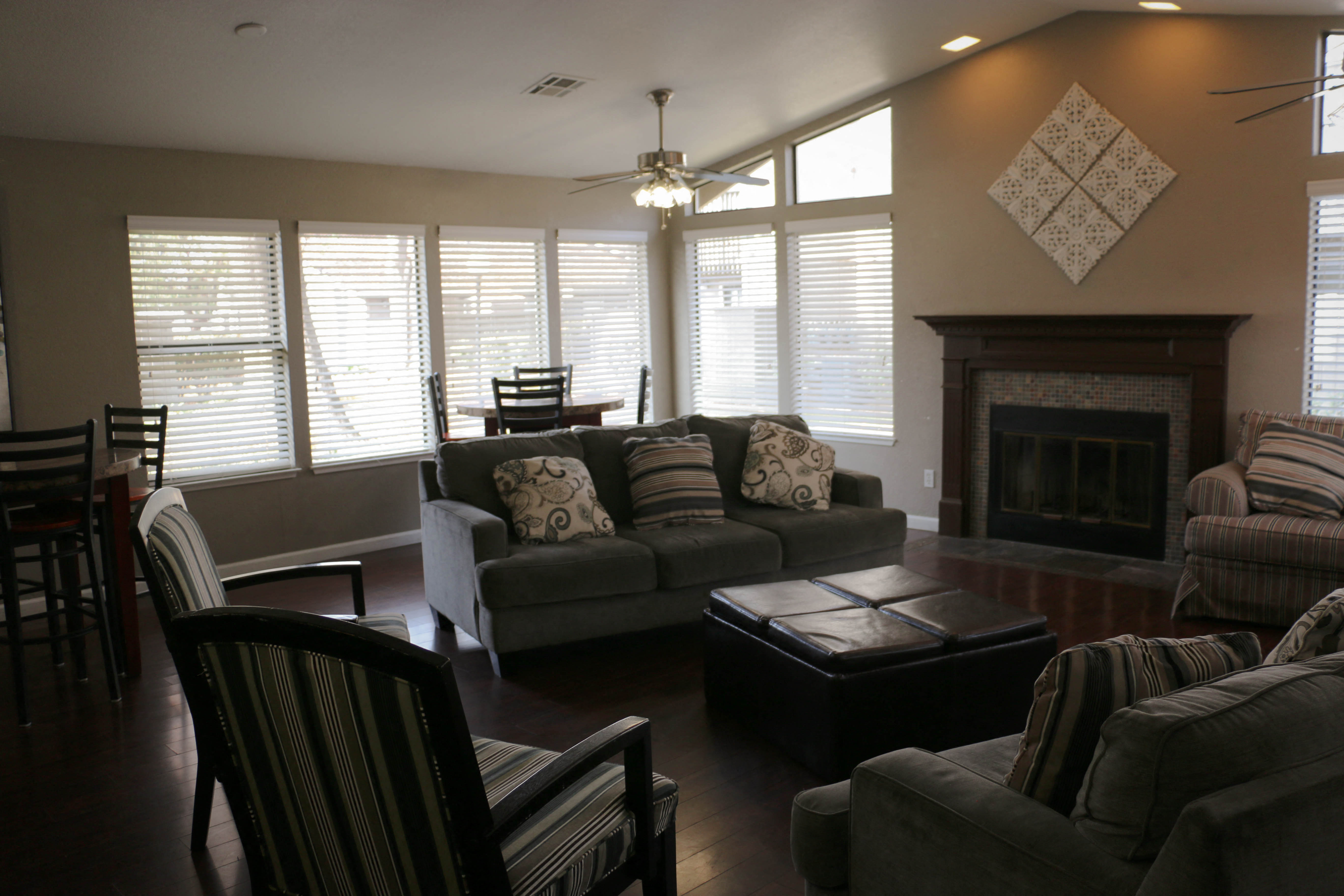 a living room with a couch and a table and a fireplace