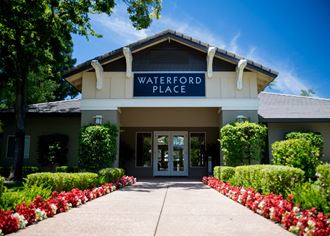 a waterford place building with a blue sign on the top of it