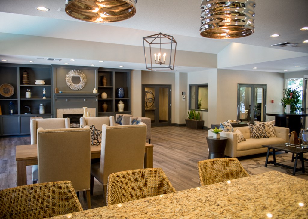 a living room with couches and chairs and a table