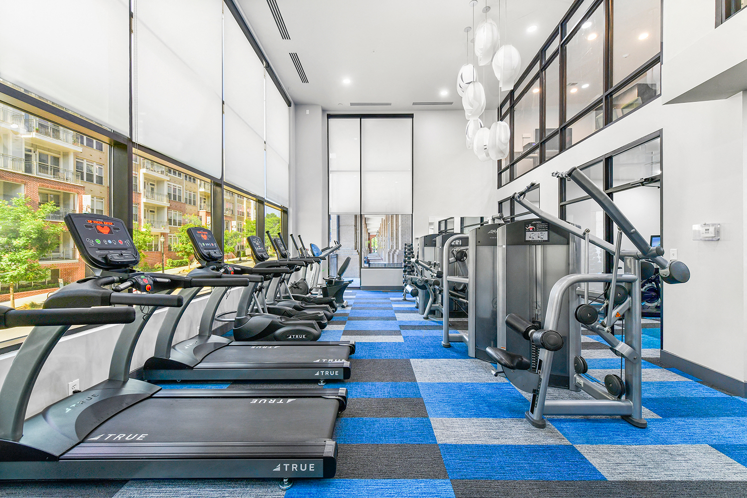 the gym has cardio equipment and treadmills in the lobby