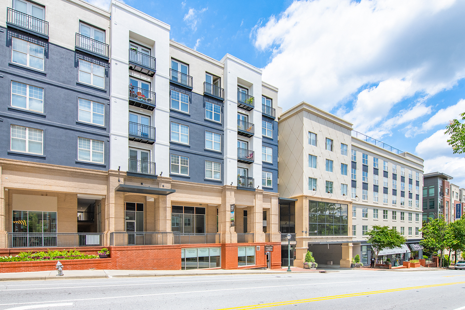 a street view of an apartment building on a city street