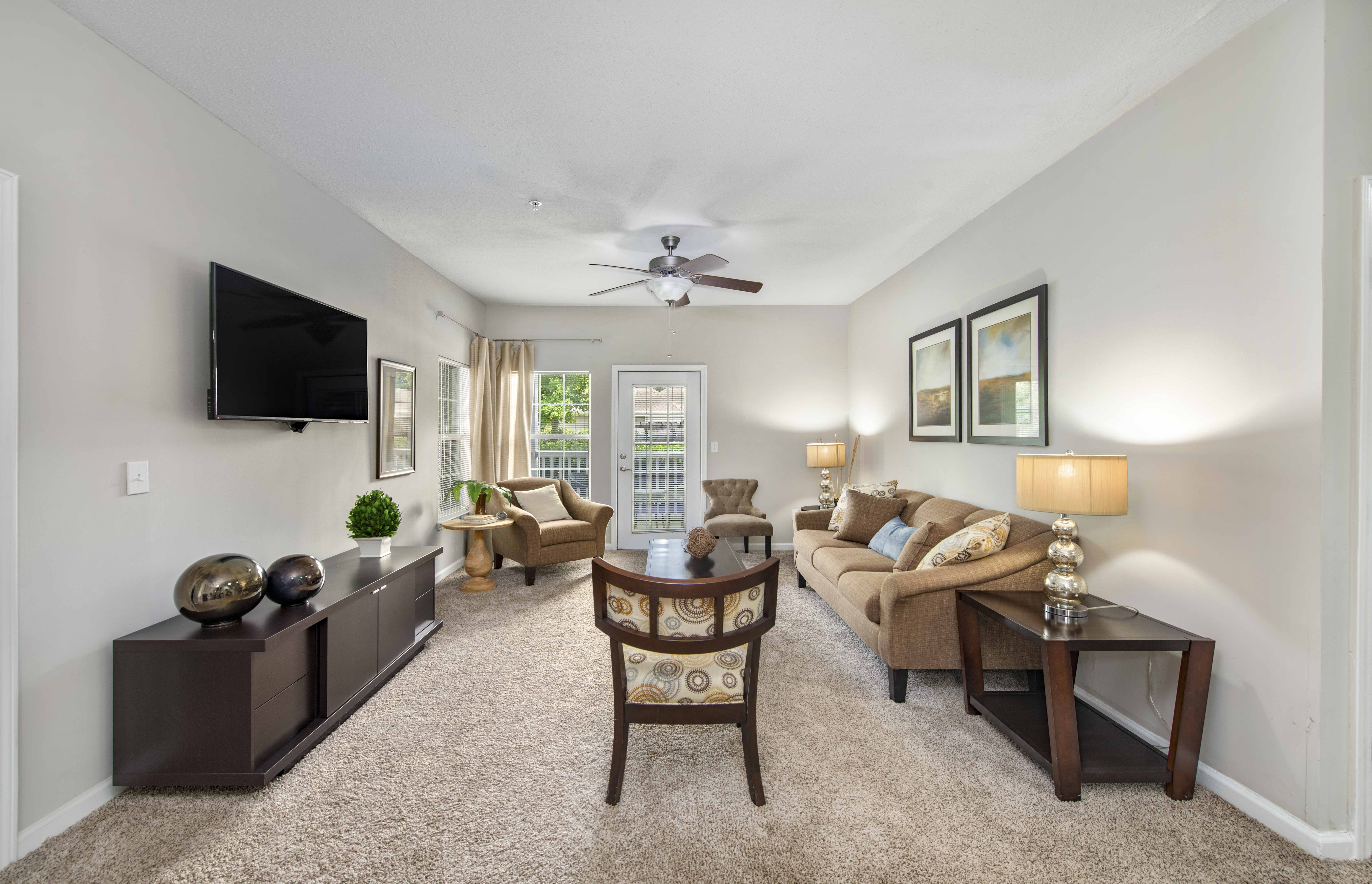 a living room with a couch and a tv