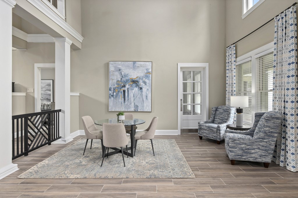 A dining room with a table set for four.