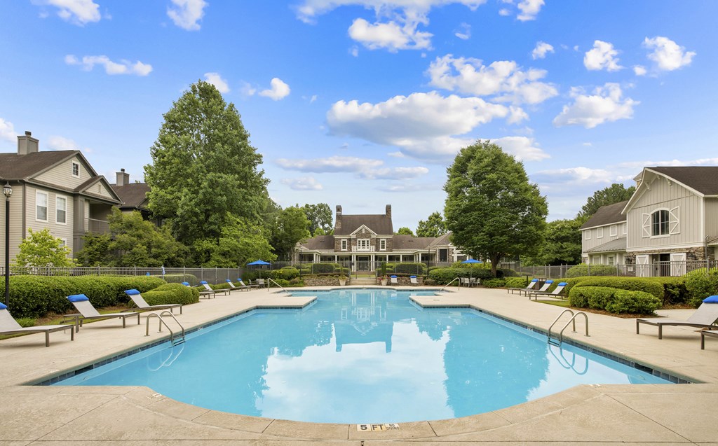 A large swimming pool in the middle of a residential area.
