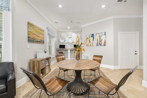 a dining room with a table and chairs