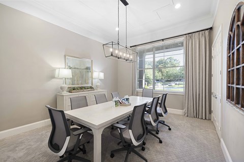 a dining room with a table and chairs