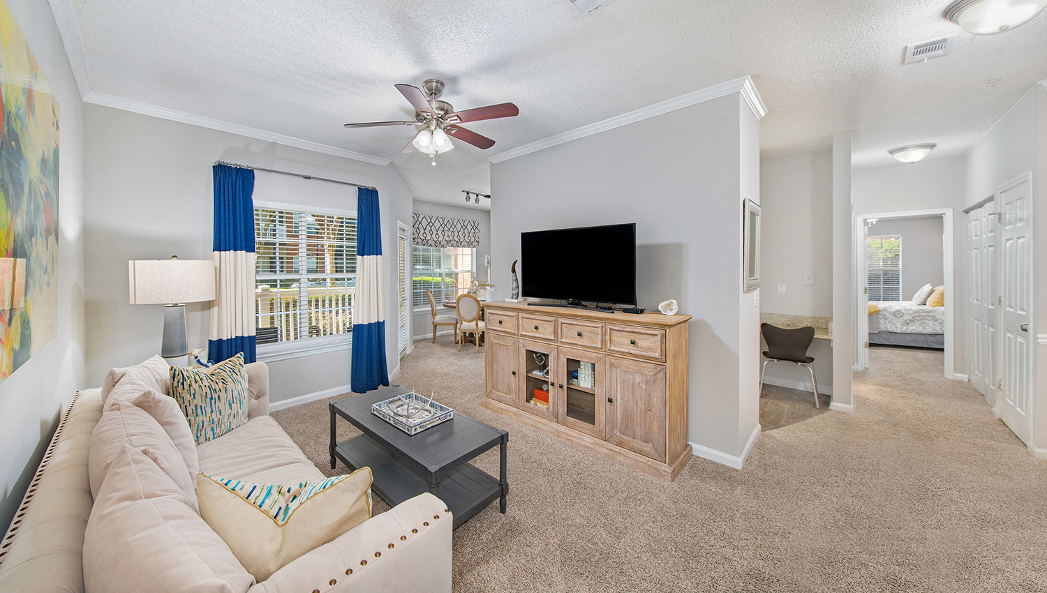 a living room with a couch and a tv