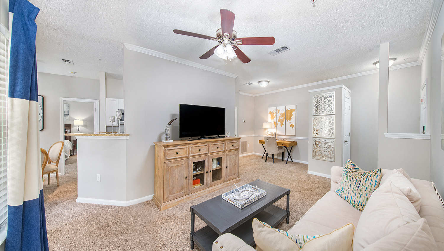 a living room with a couch and a tv