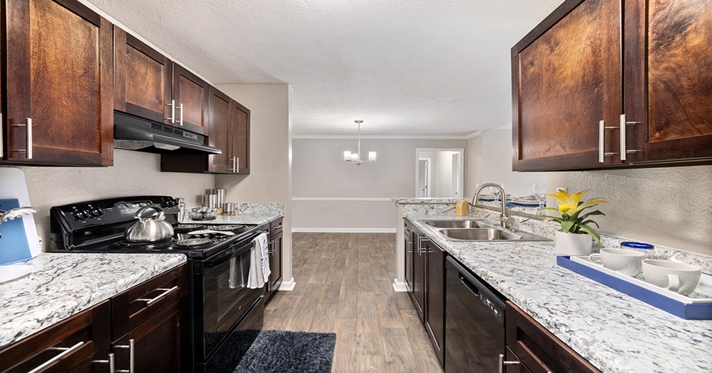 our spacious kitchen is equipped with stainless steel appliances and granite counter tops