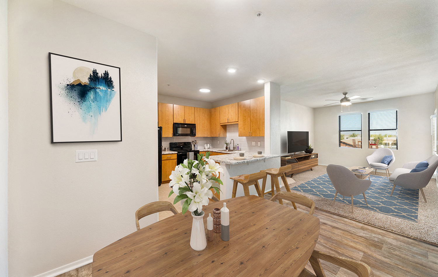 a living room with a dining room table and a kitchen