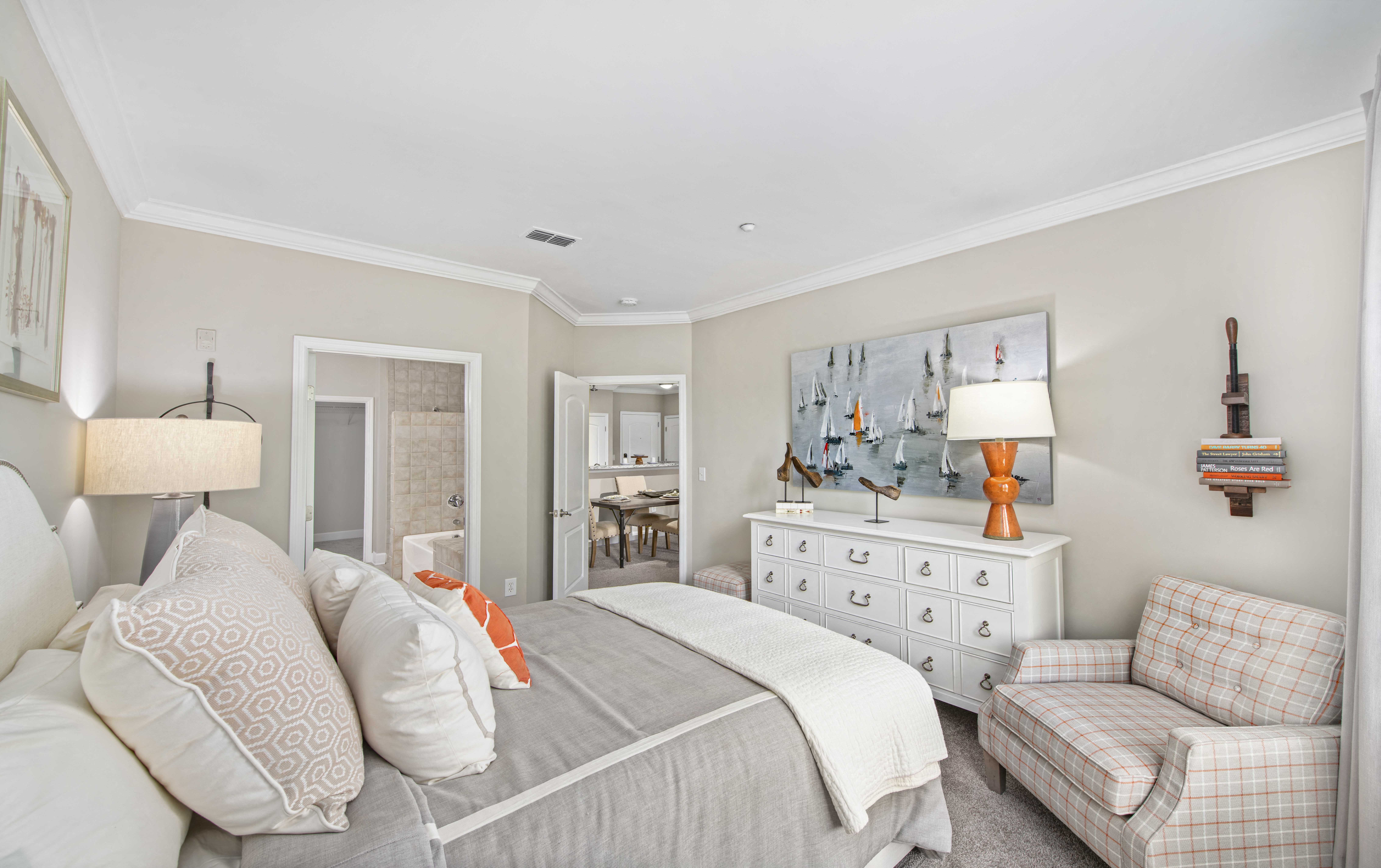 a bedroom with a bed and a dresser