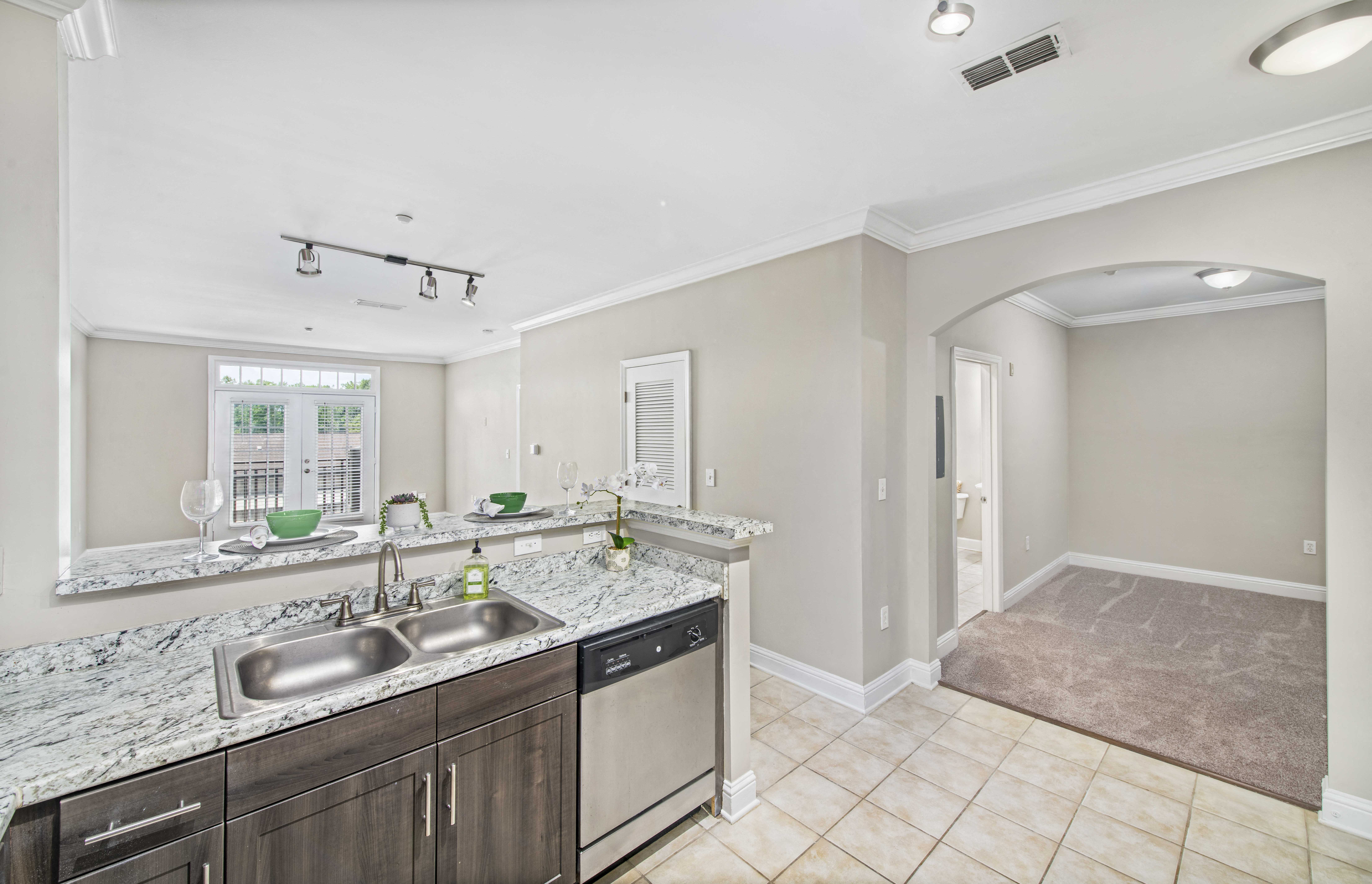 a kitchen with a sink and a counter top