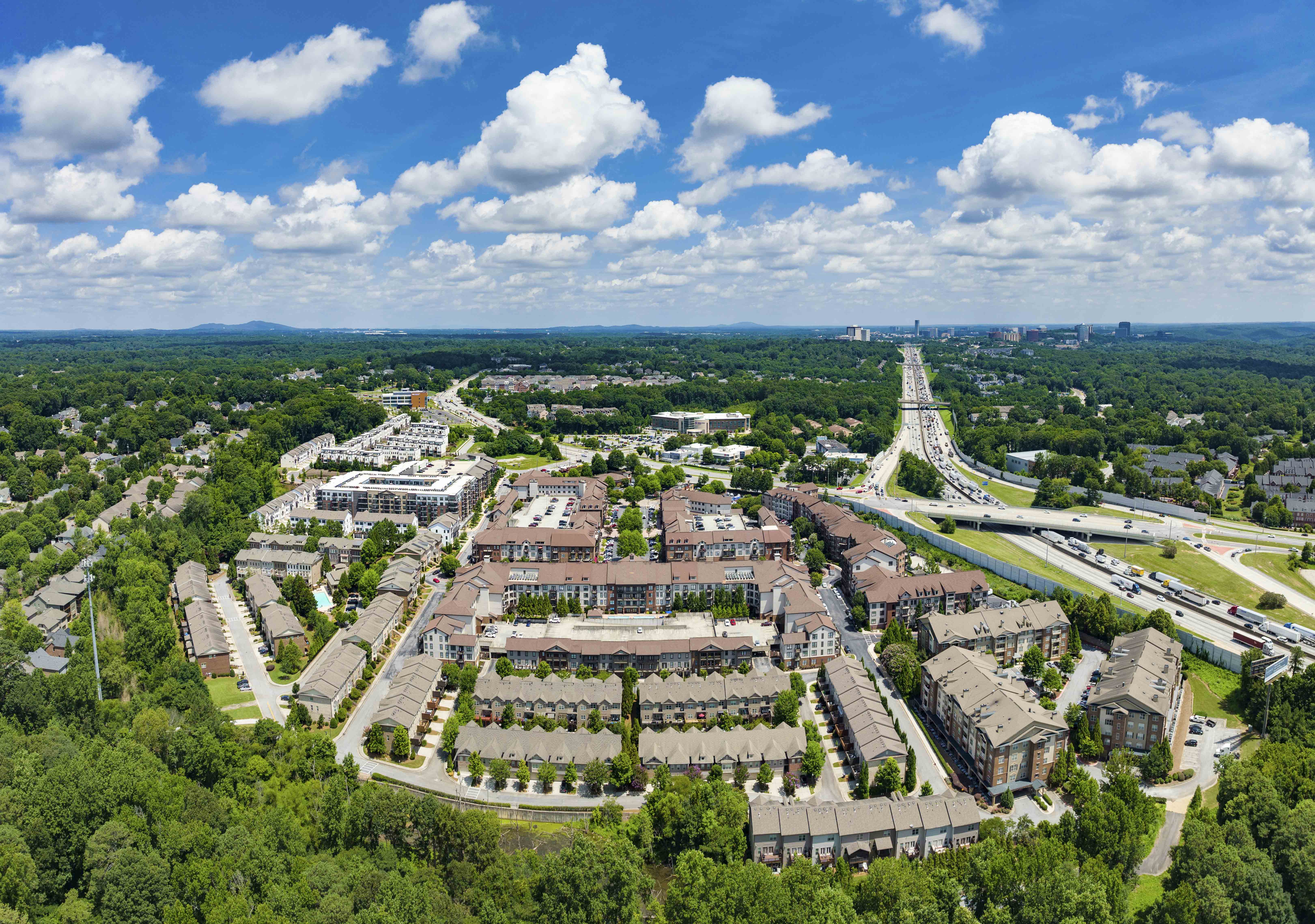 an aerial view of a city with buildings and trees