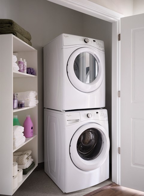 a white washer and dryer in a laundry room