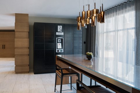 a dining room with a long table and chairs and a chandelier