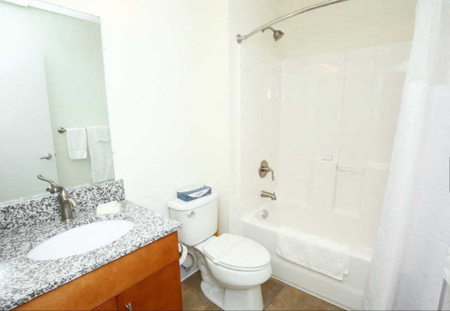 a bathroom with a sink toilet and a shower