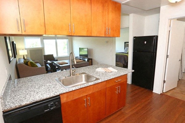 a kitchen with a granite counter top and a sink