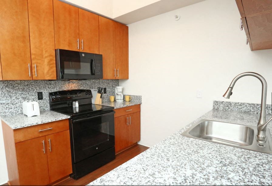 a kitchen with granite counter tops and a sink
