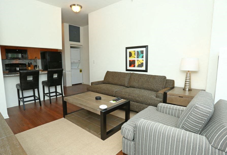 a living room with a couch and a table