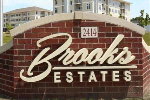 a sign on the side of a brick building