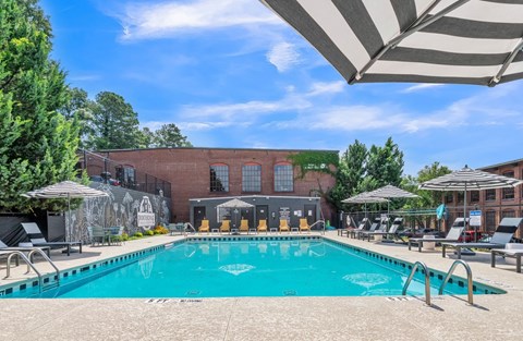A large swimming pool with a mural on the wall behind it.