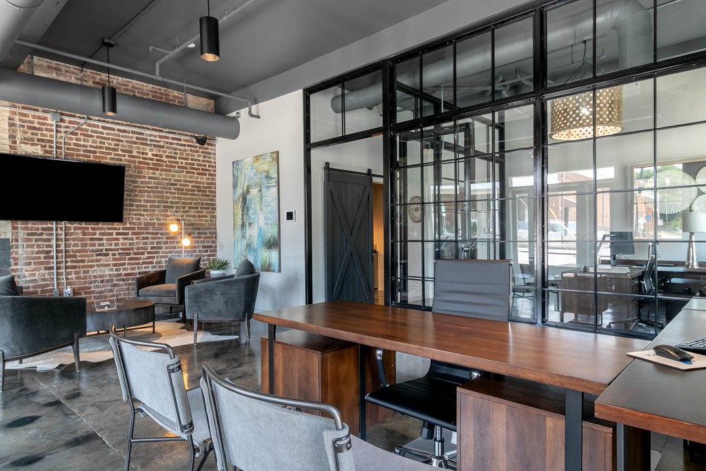 a conference room with a wooden table and chairs