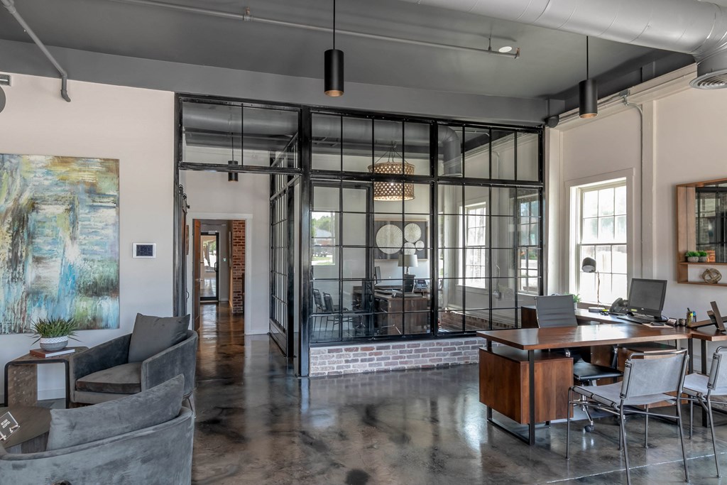 a living room and dining room with glass walls and a table and chairs