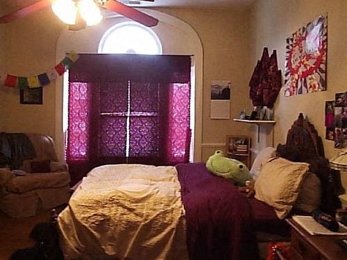 a bedroom with a bed with a stuffed animal on it