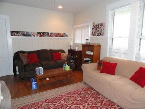 a living room with two couches and a table