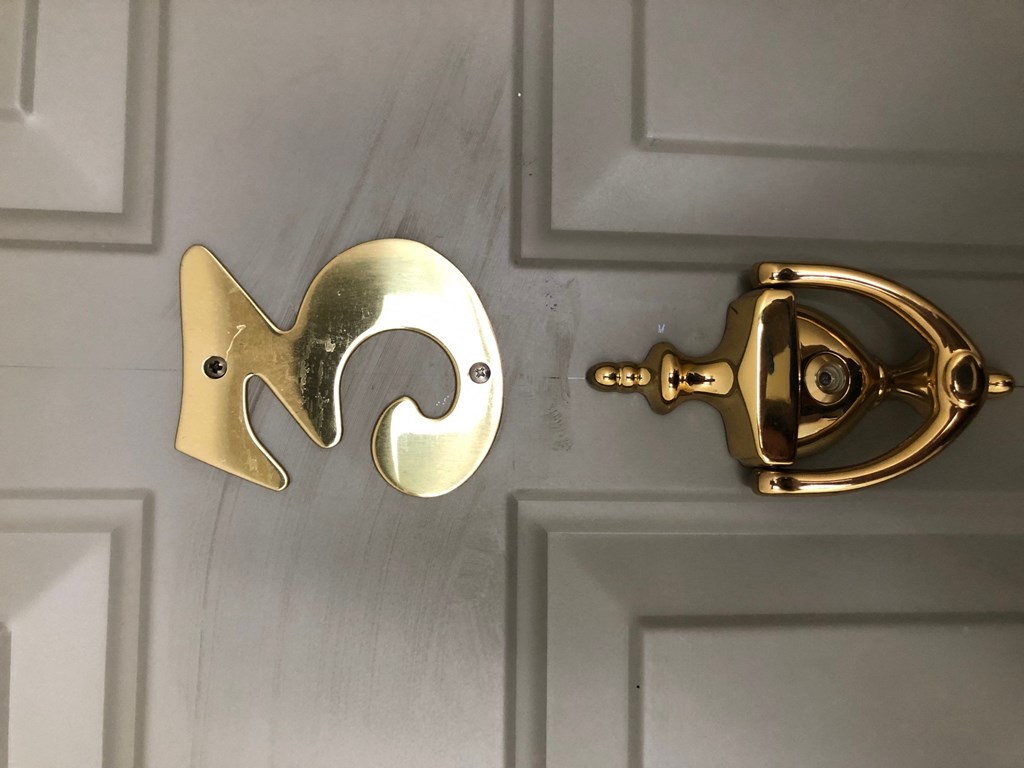 an open door with a door handle shaped like a fish