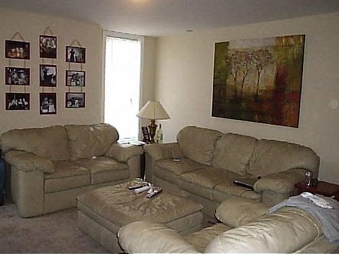 a living room with two couches and a table