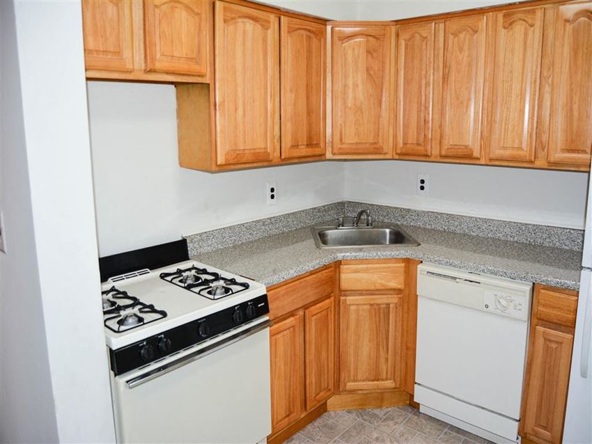 a small kitchen with a stove and a sink