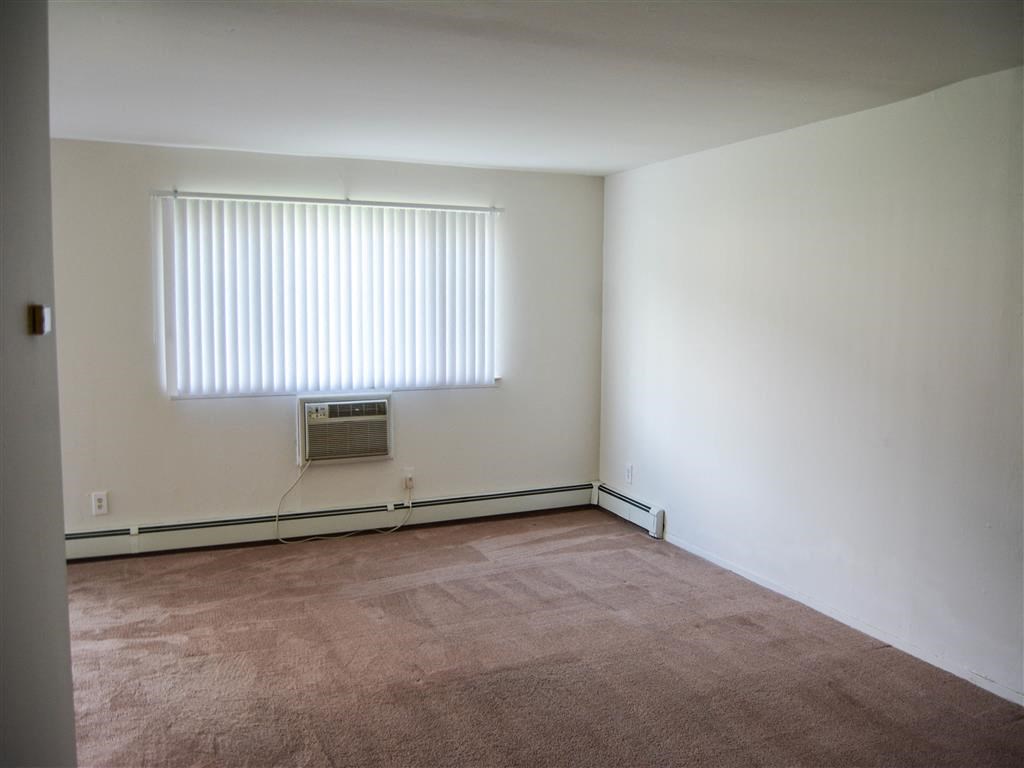 Carpeted Living Area at Brookwood at Holbrook, New York