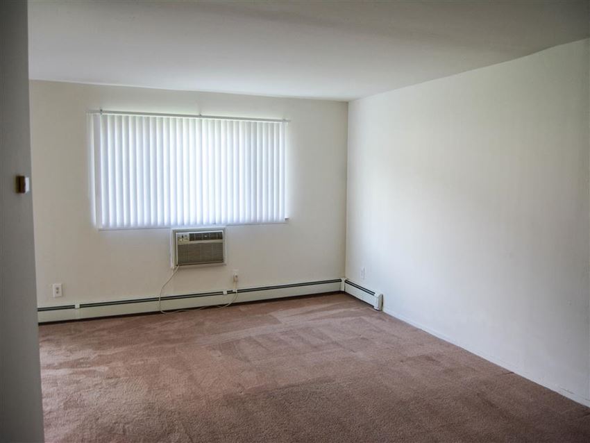 an empty room with a window and