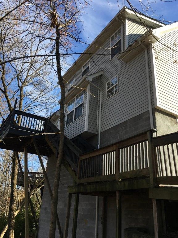 a house with a deck on the back of it