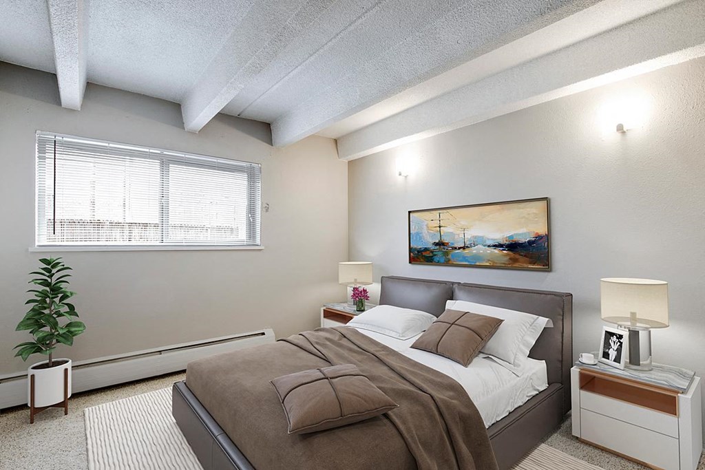 a bedroom with a bed and a window