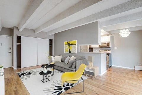 a living room with a couch and a yellow chair