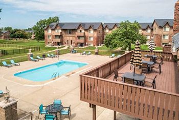 Swimming pool with sundeck at Grand Blanc apartments