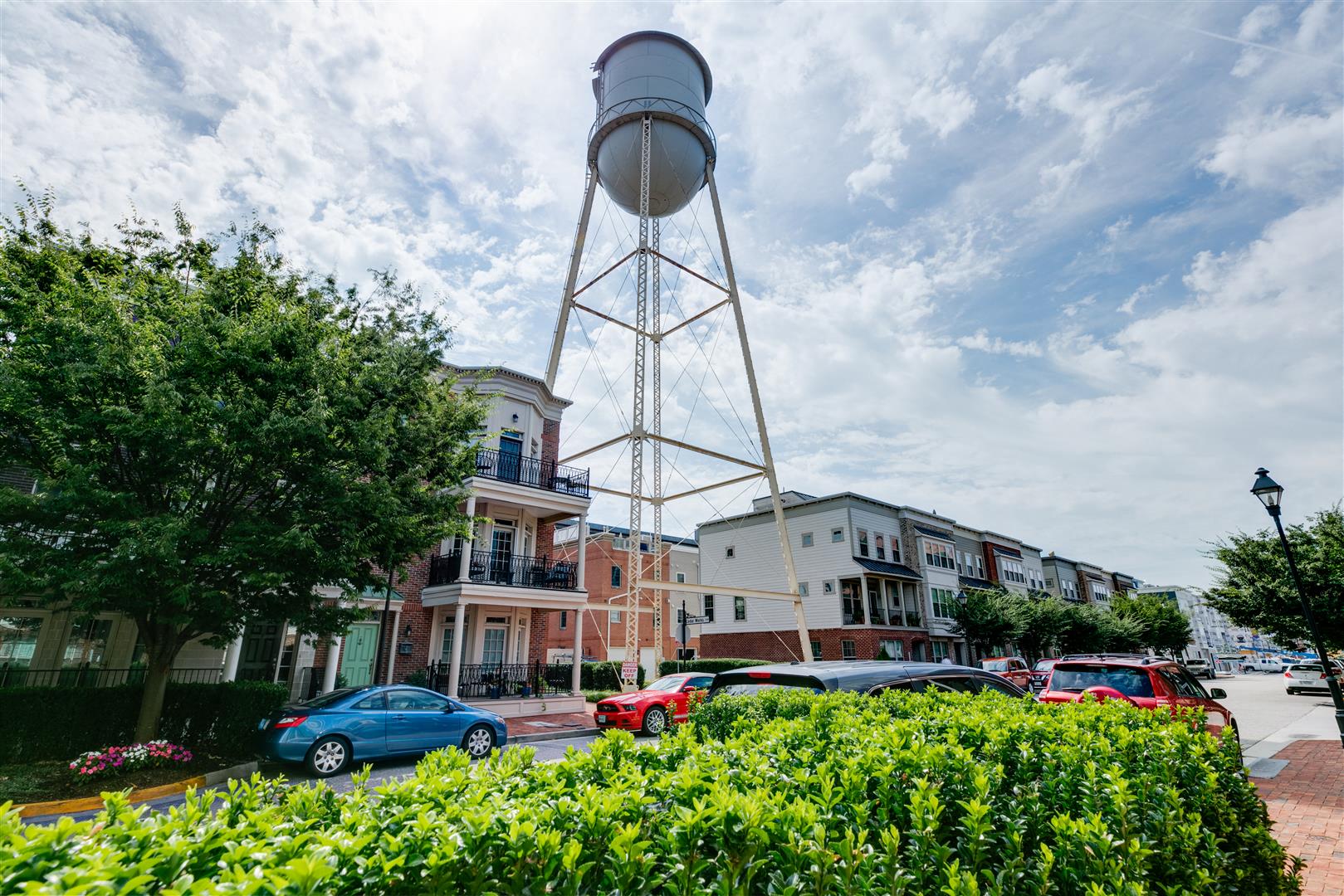 a water tower in the middle of a city street